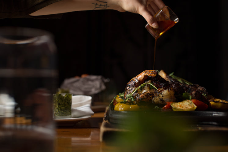 Pouring Butter On Surf And Turf