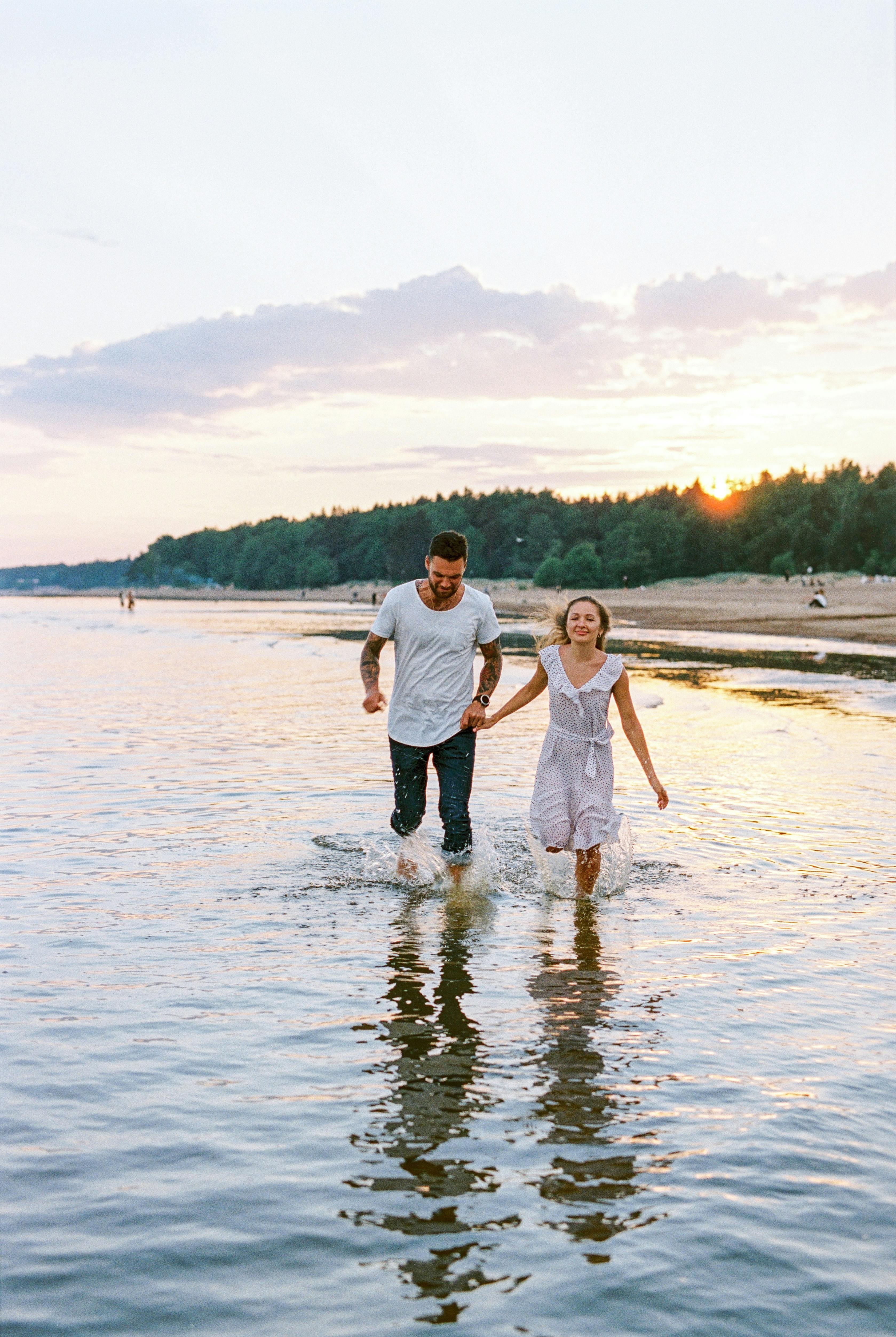 couple walking in lake