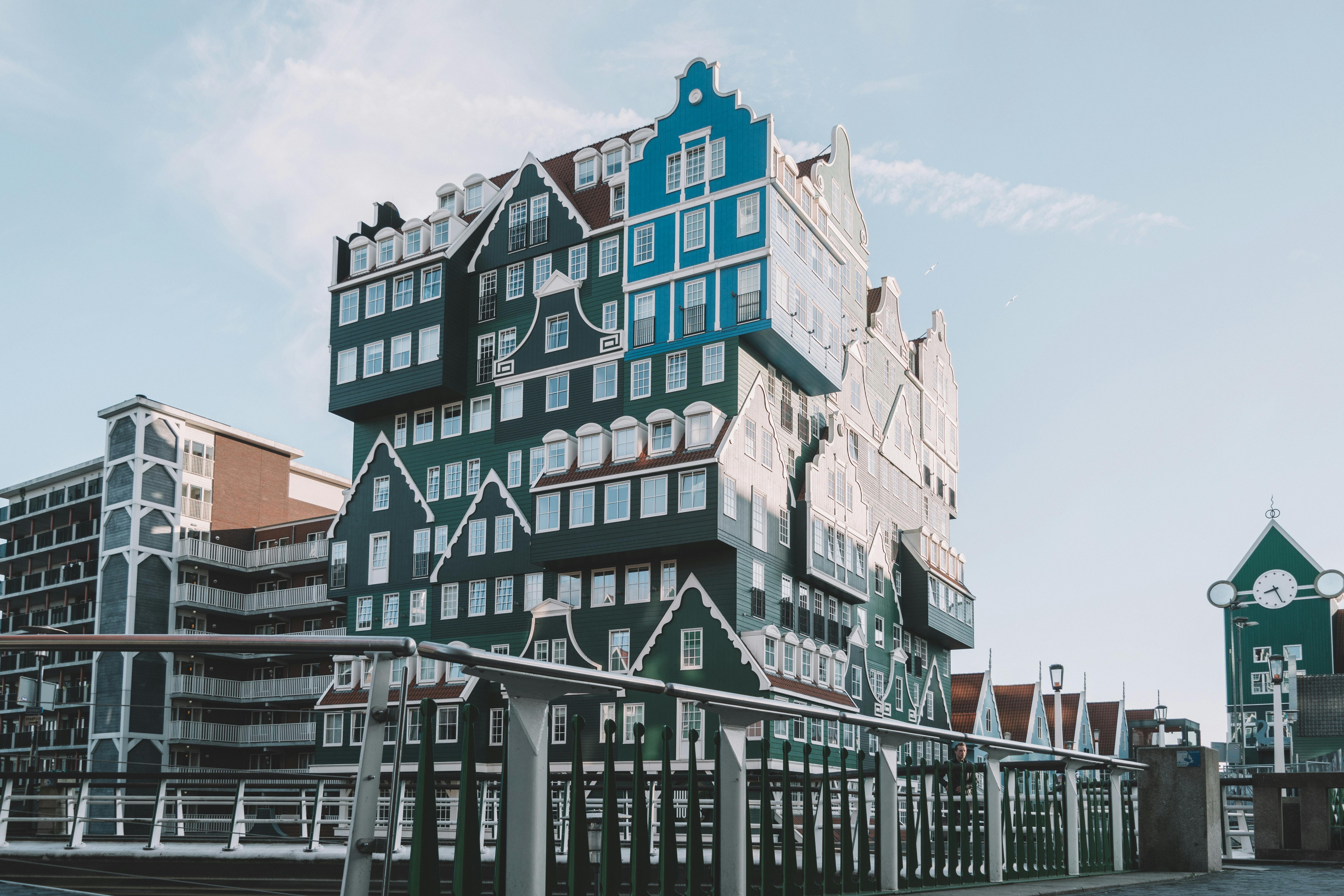 green and blue multi story building