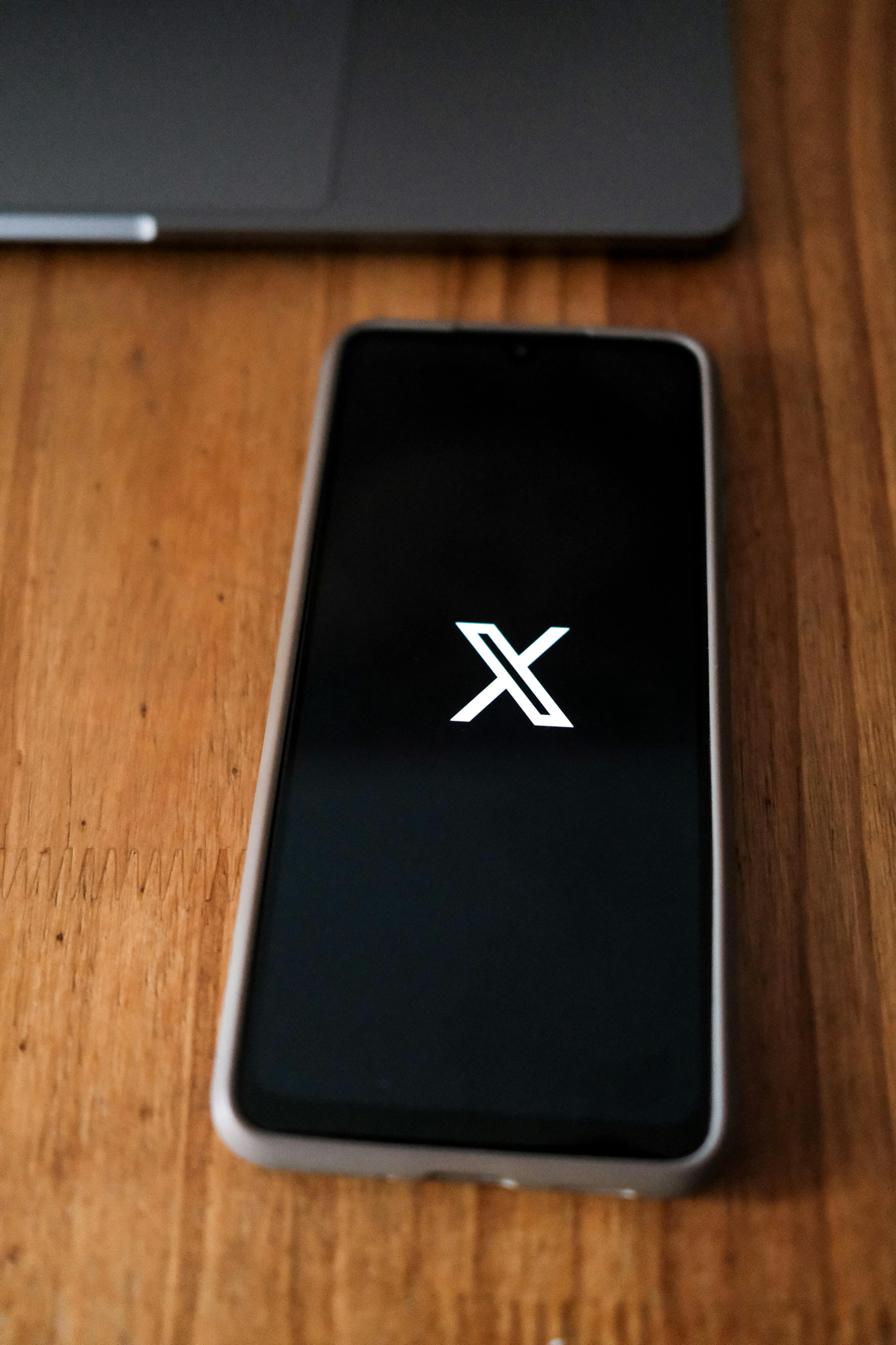 smartphone with social media icon on desk