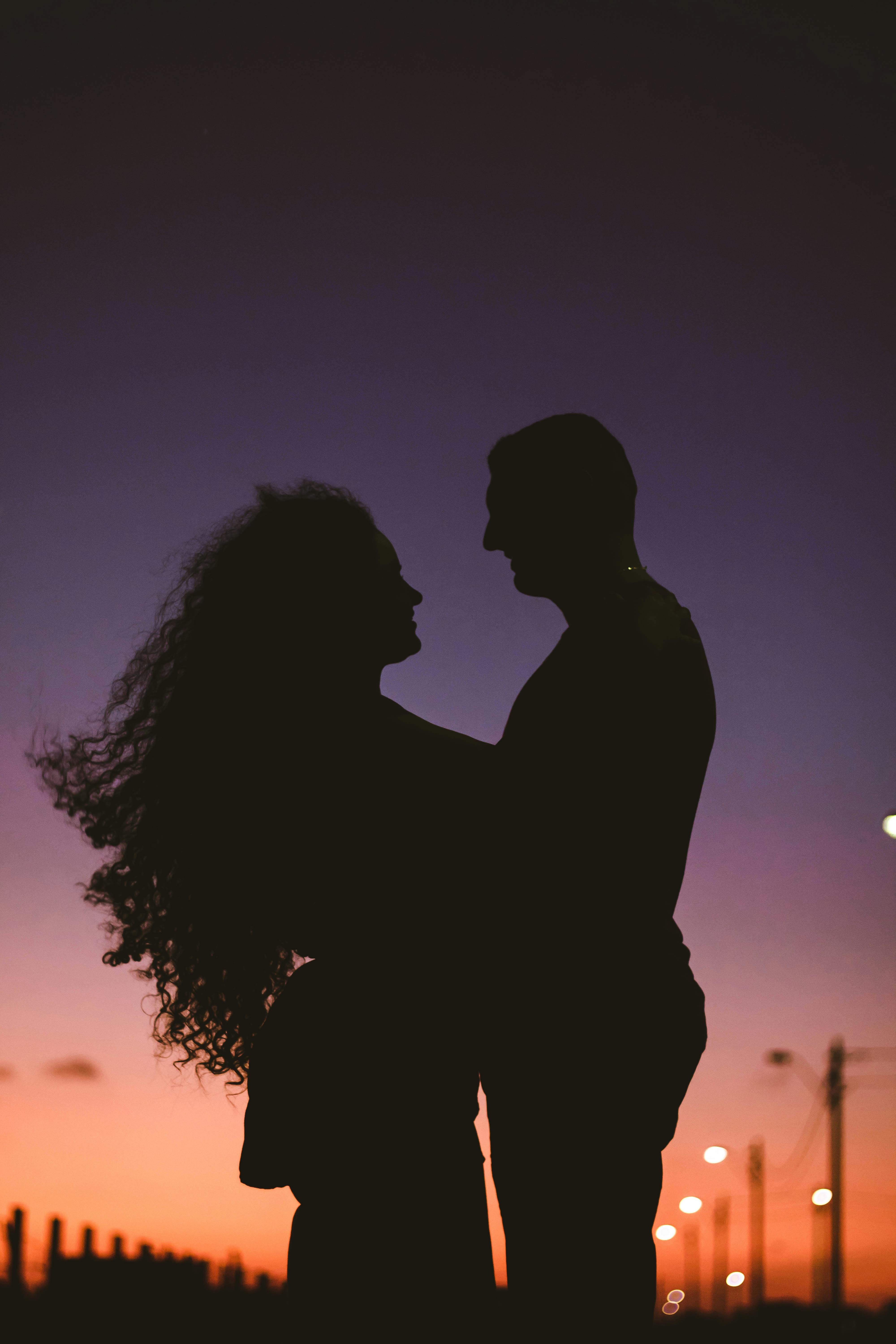 silhoutte of man and woman embracing