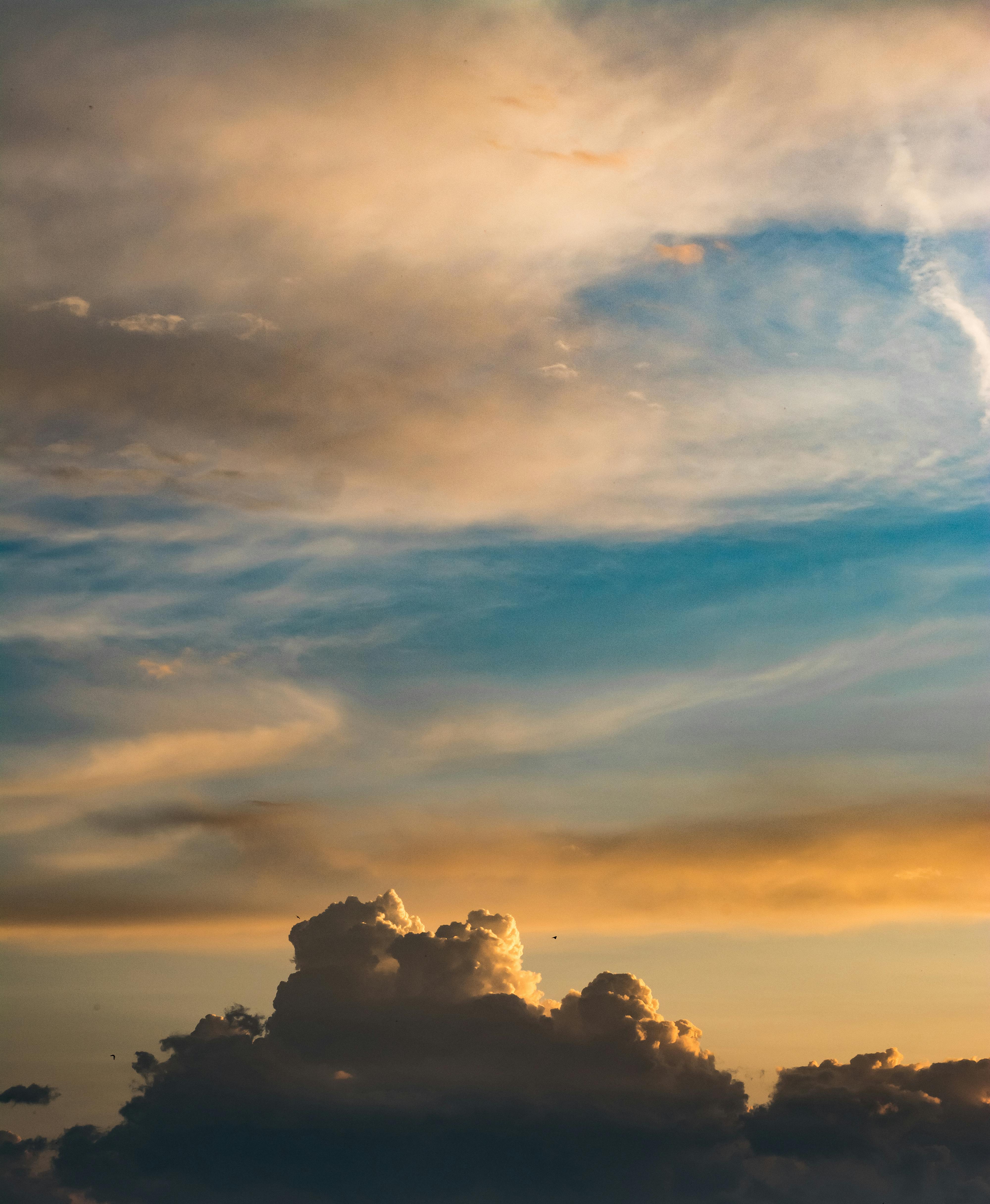 photo of clouds during golden hour