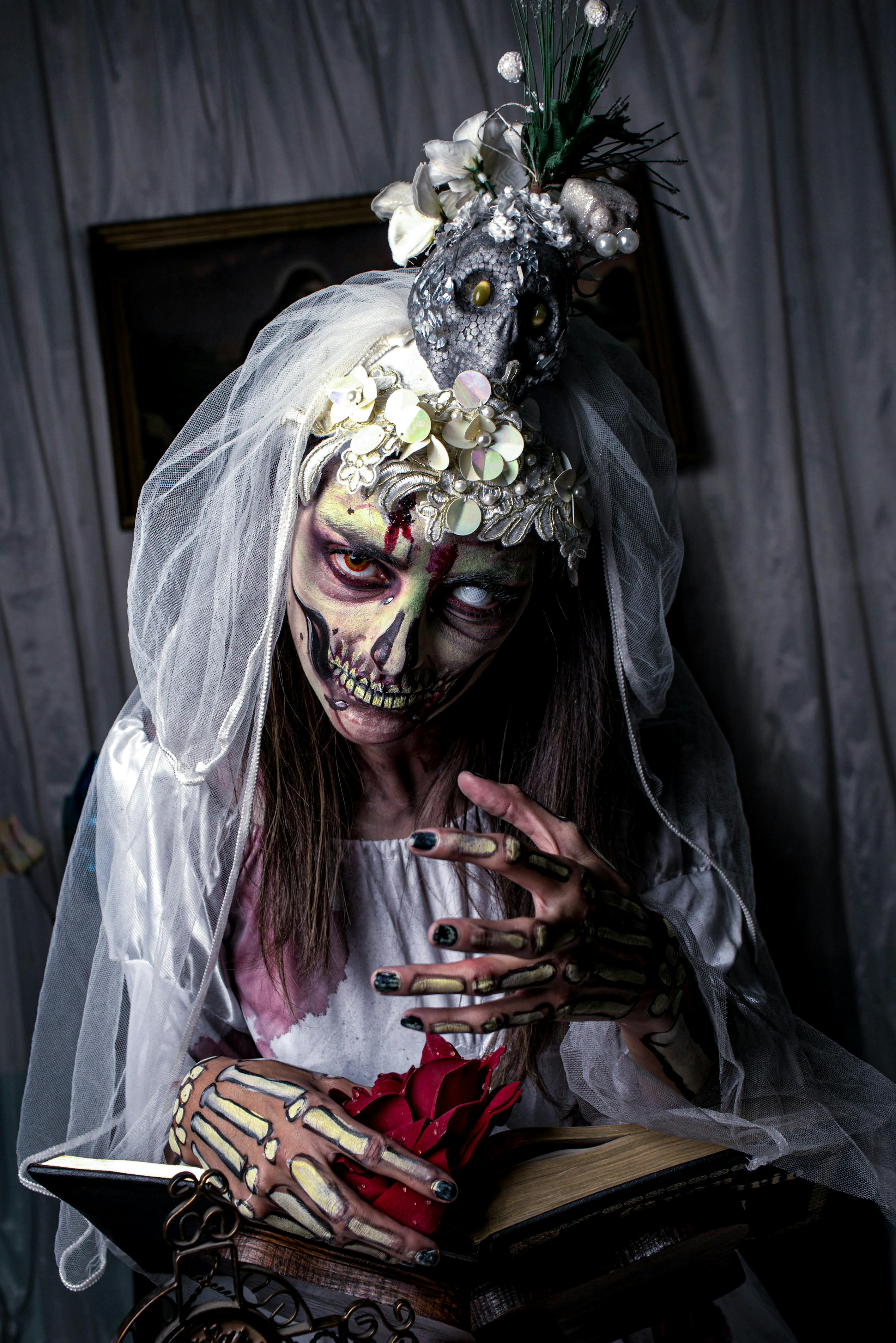 haunting bride in skeleton makeup reading