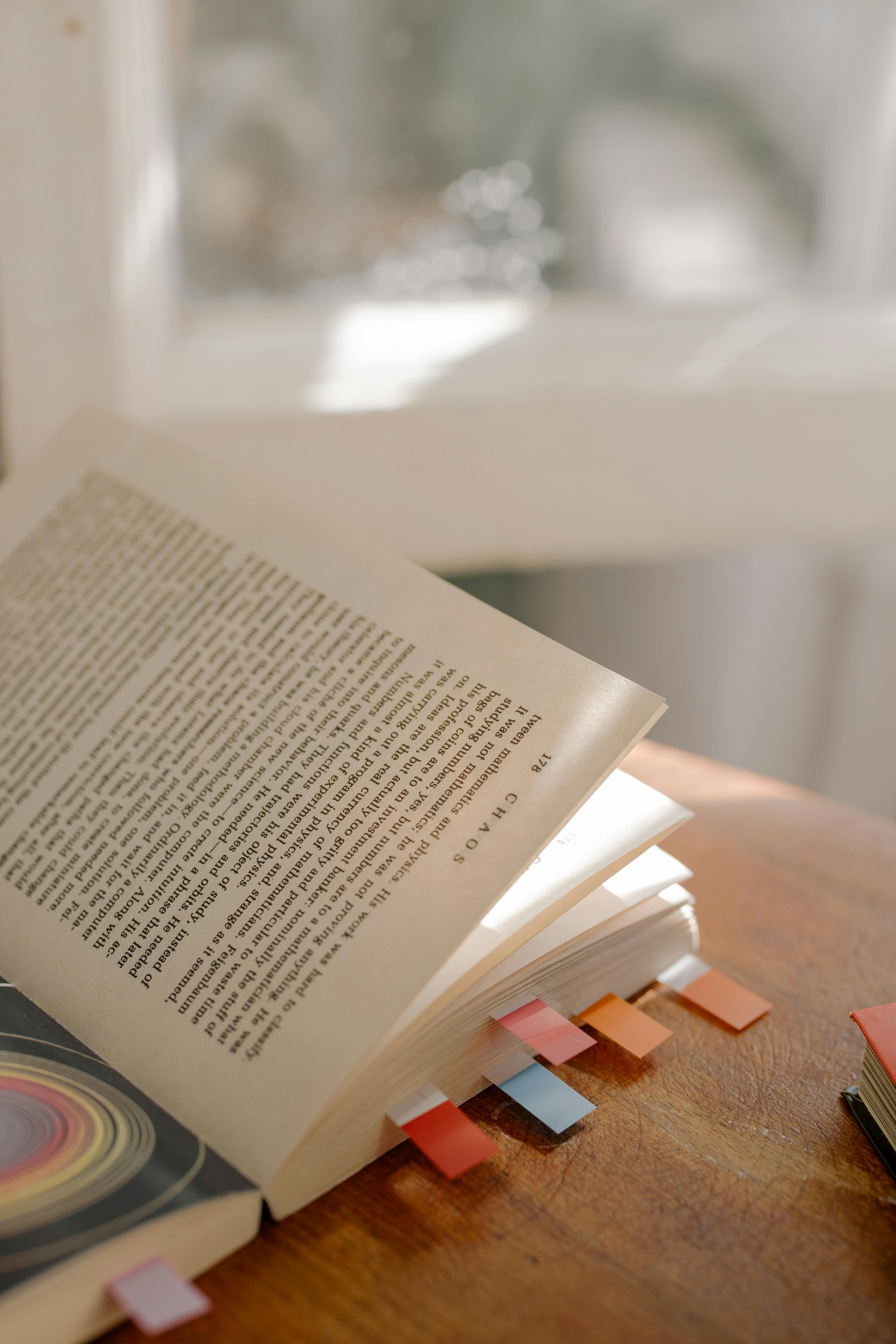 white book page on brown wooden table