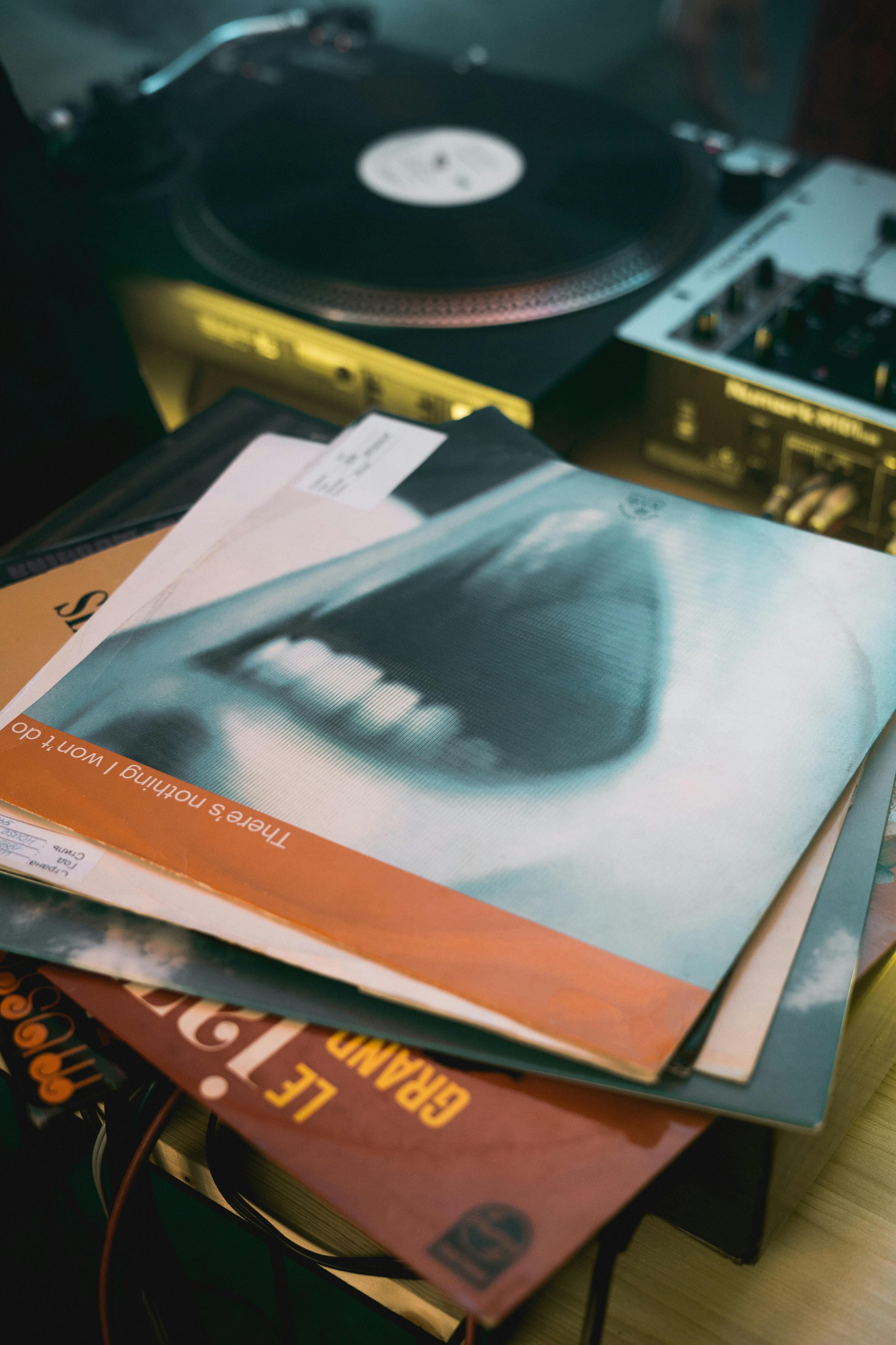 close up photo of stacked vinyl records