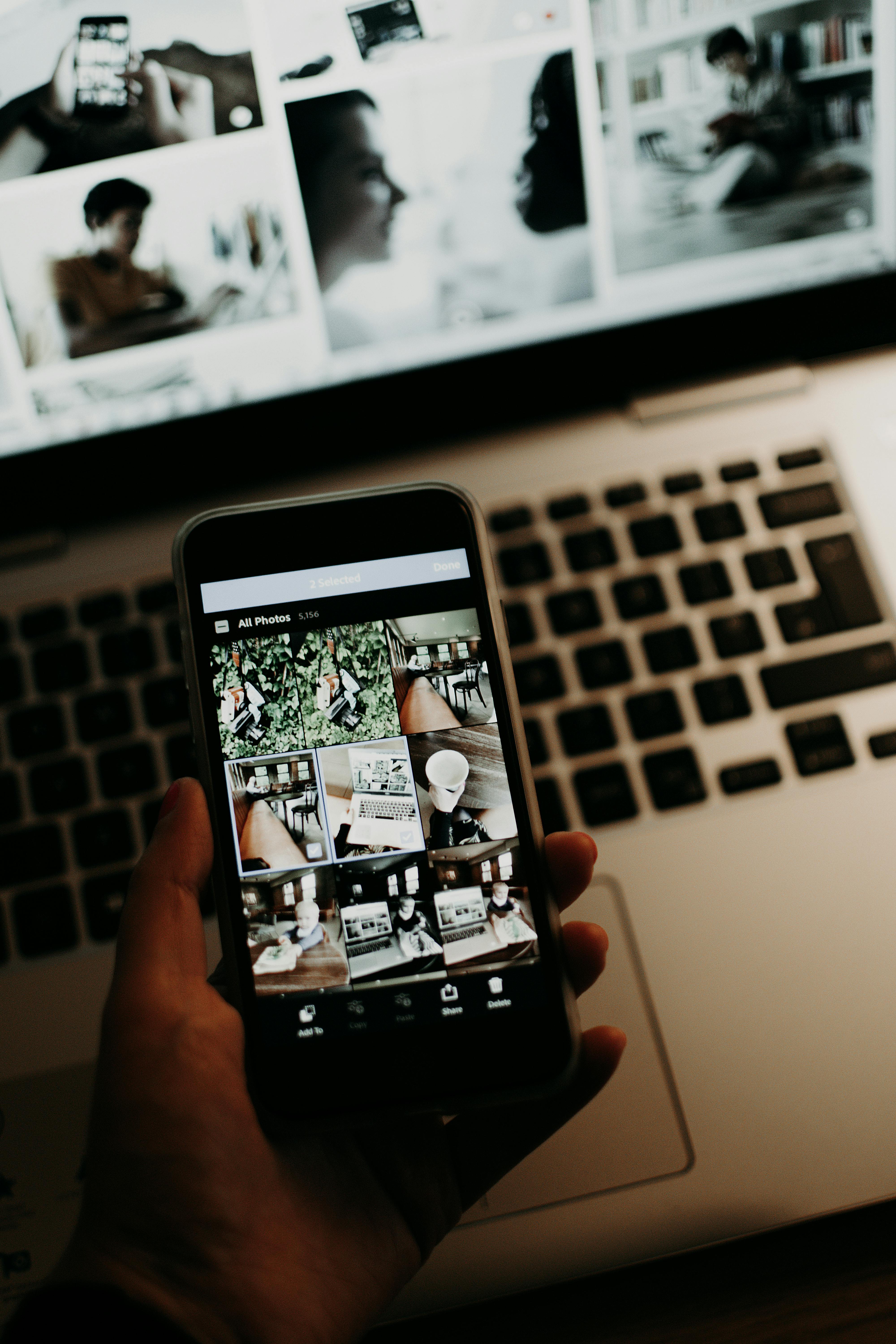 close up of a person looking at photos on a smartphone