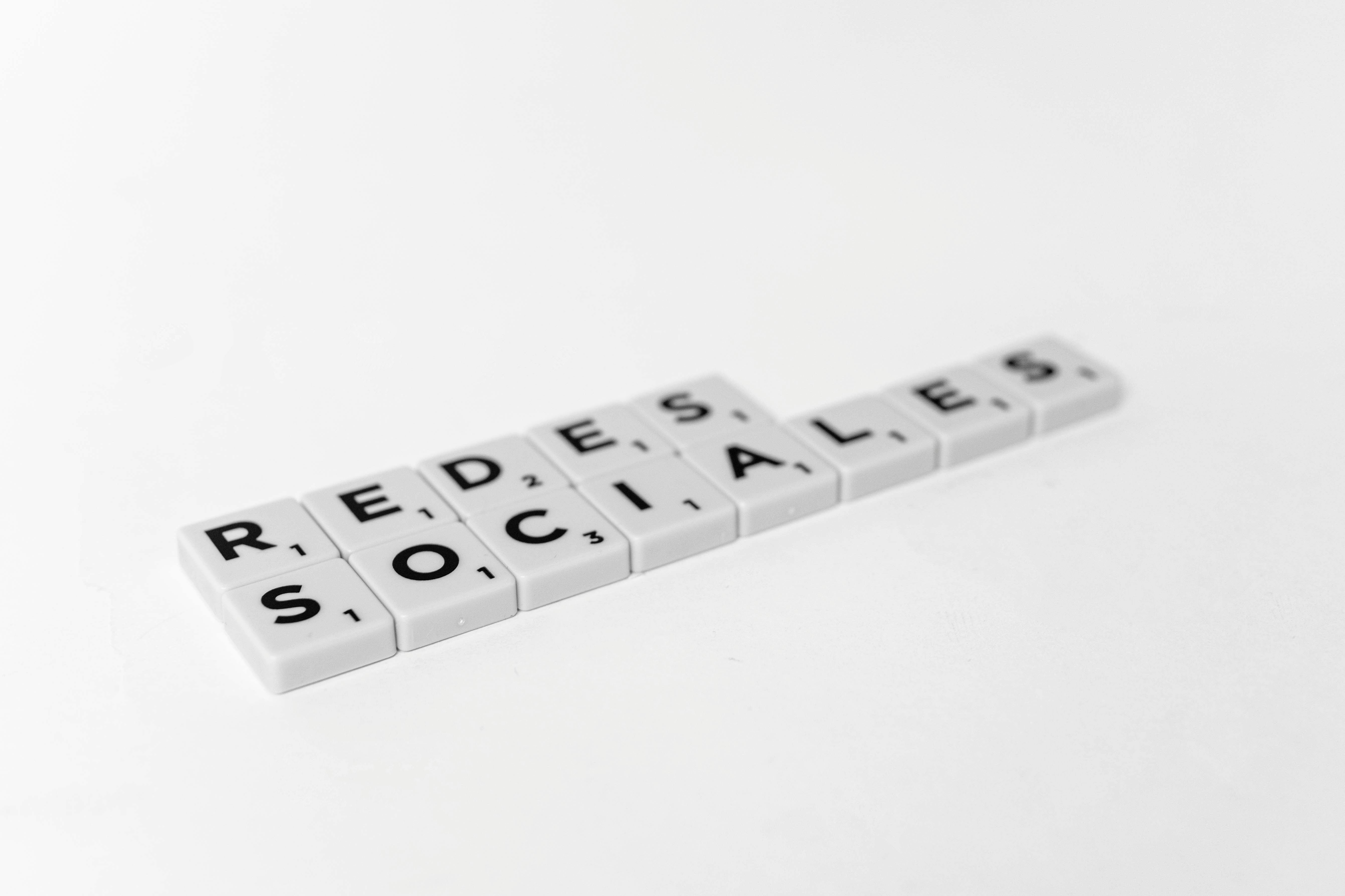 social networks in spanish text made of scrabble blocks