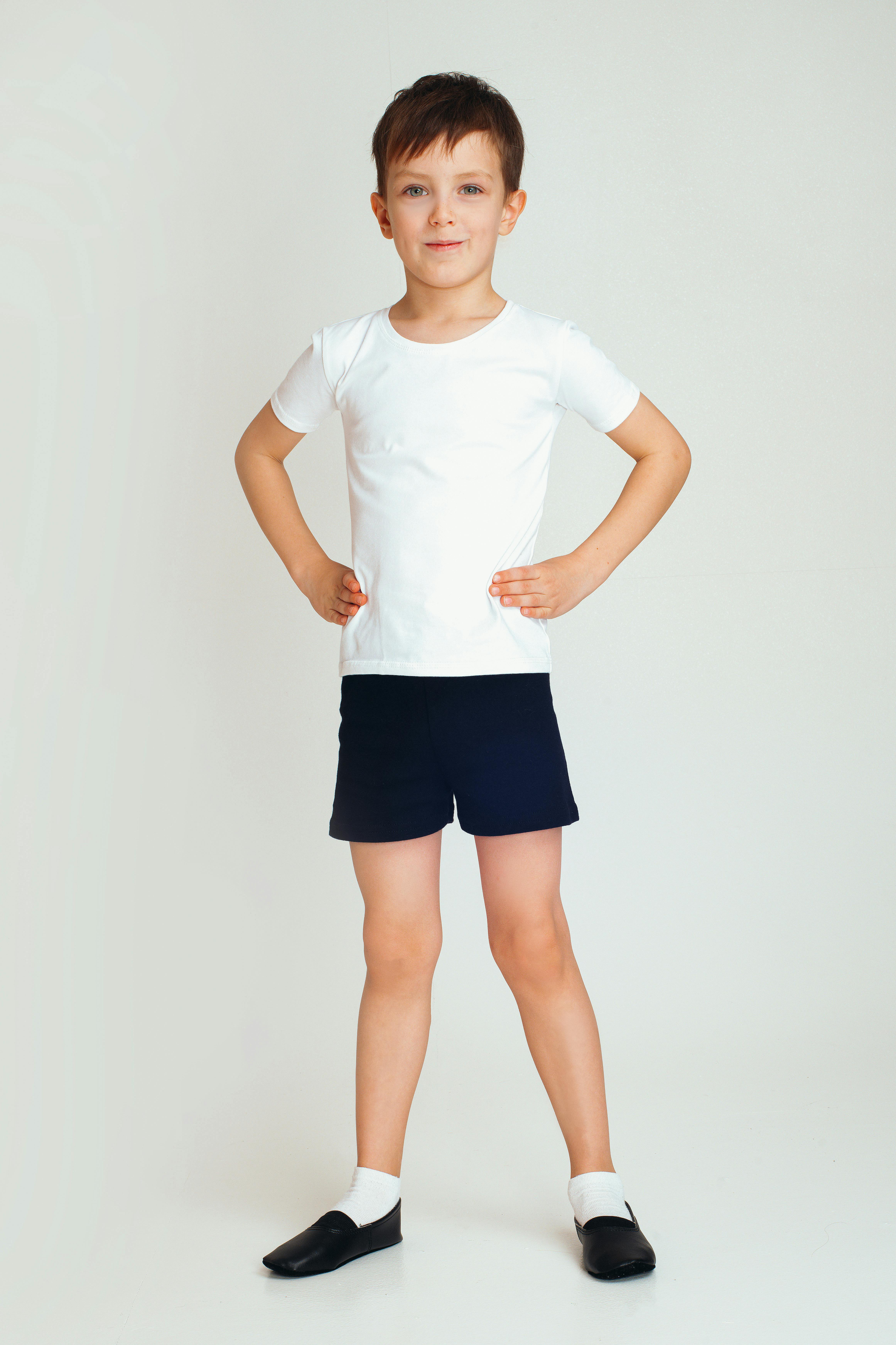positive boy with hands on waist