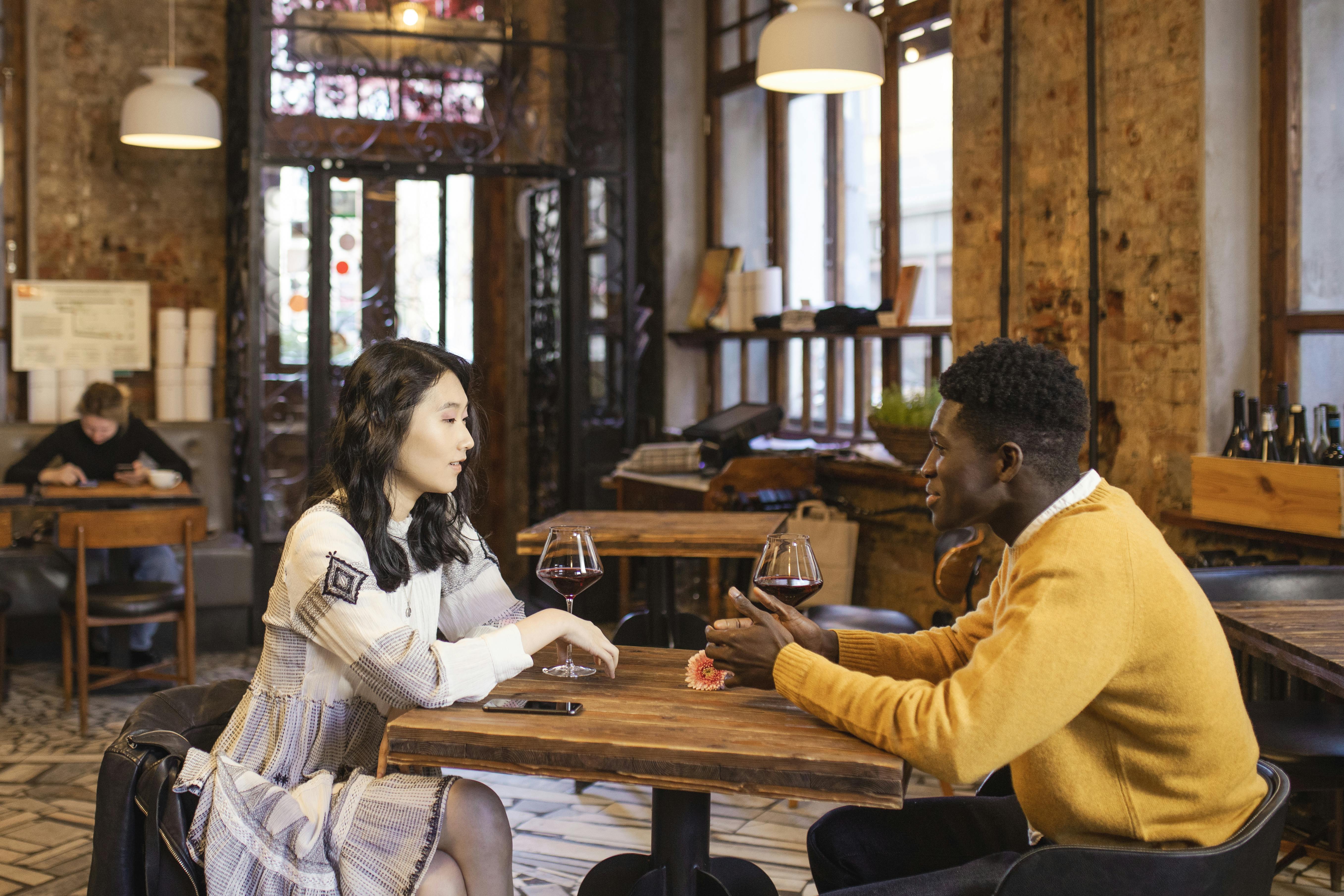 two people meeting for the first time in a cafe