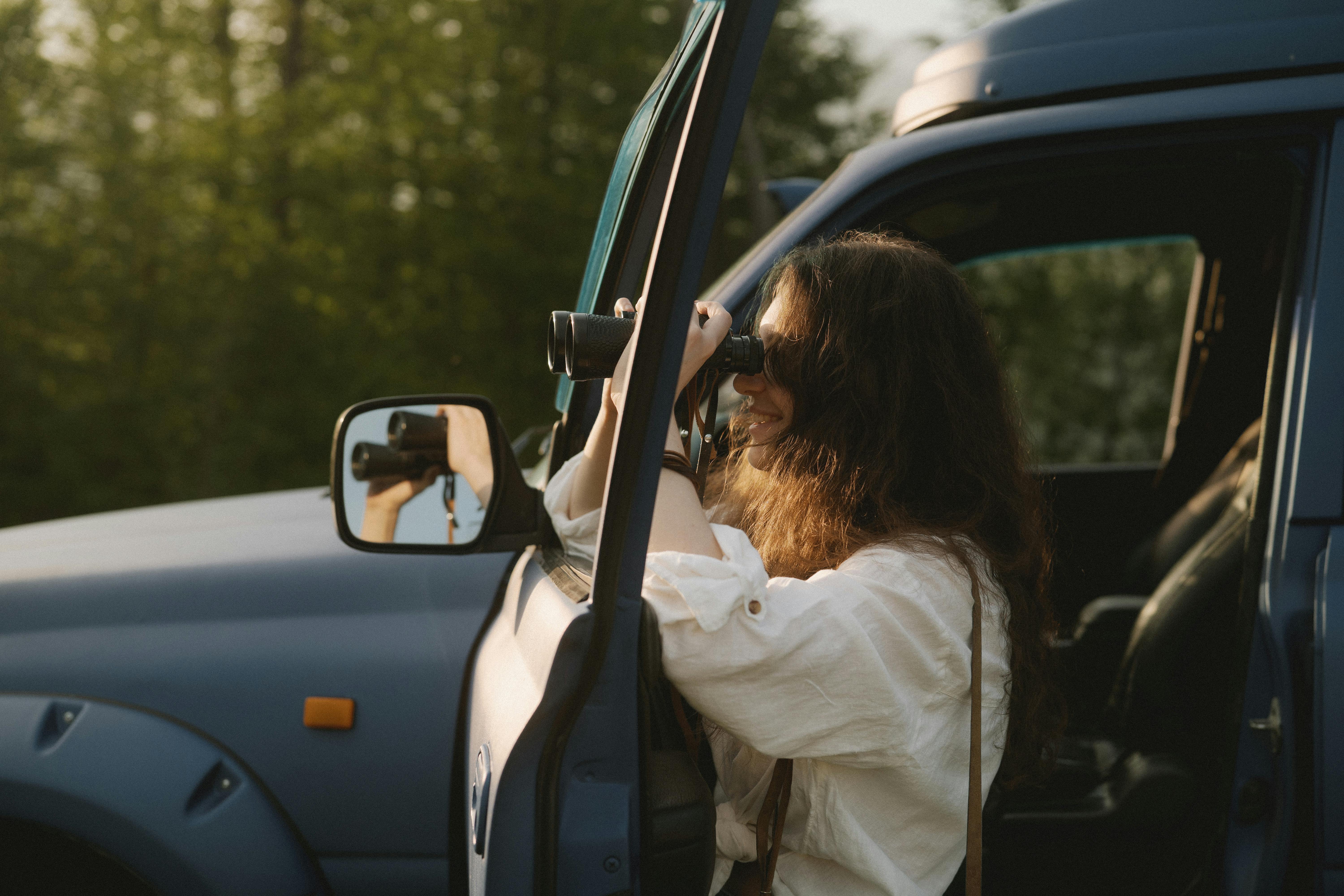 a woman looking through her binoculars