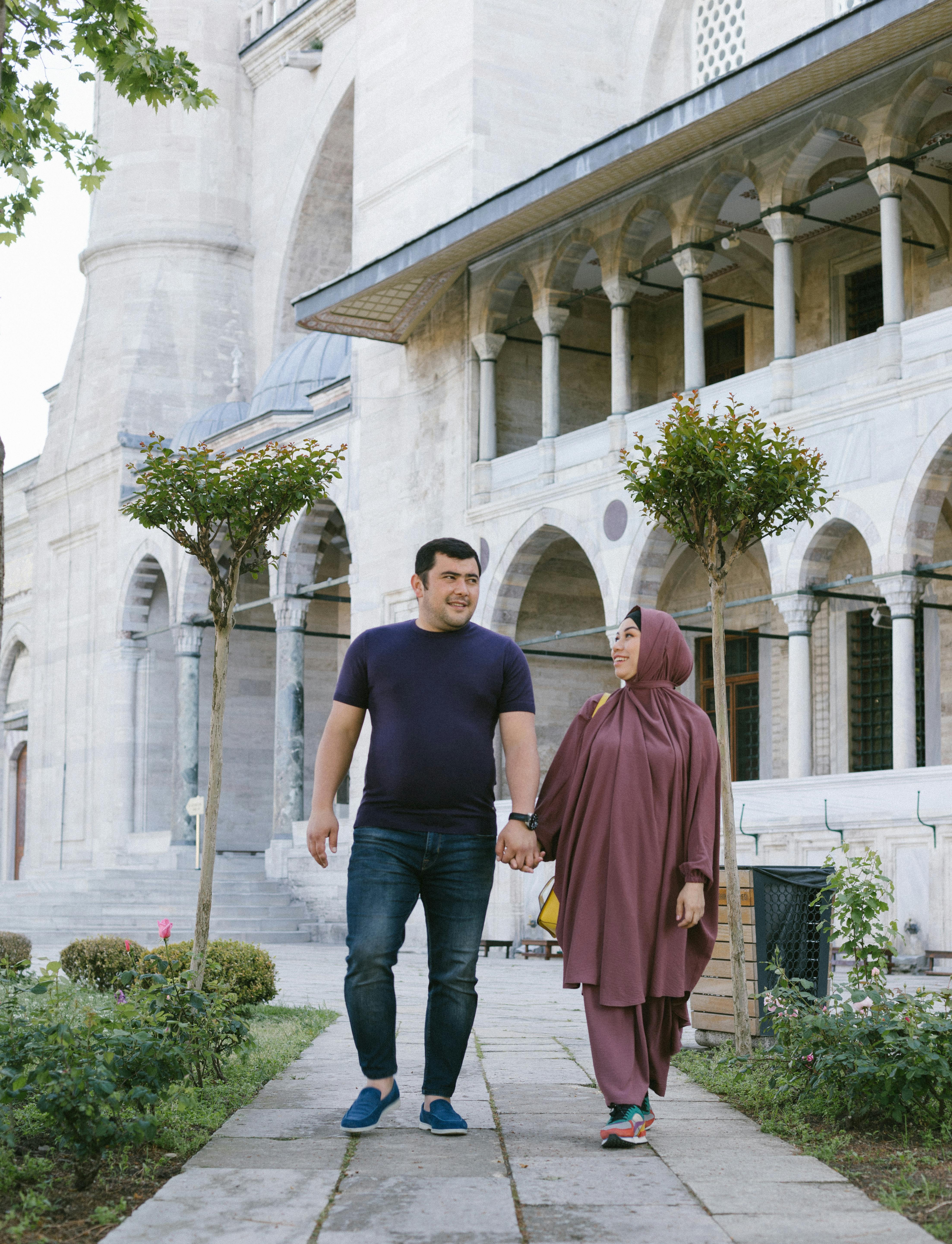 a couple walking together outside ortakoy mosque