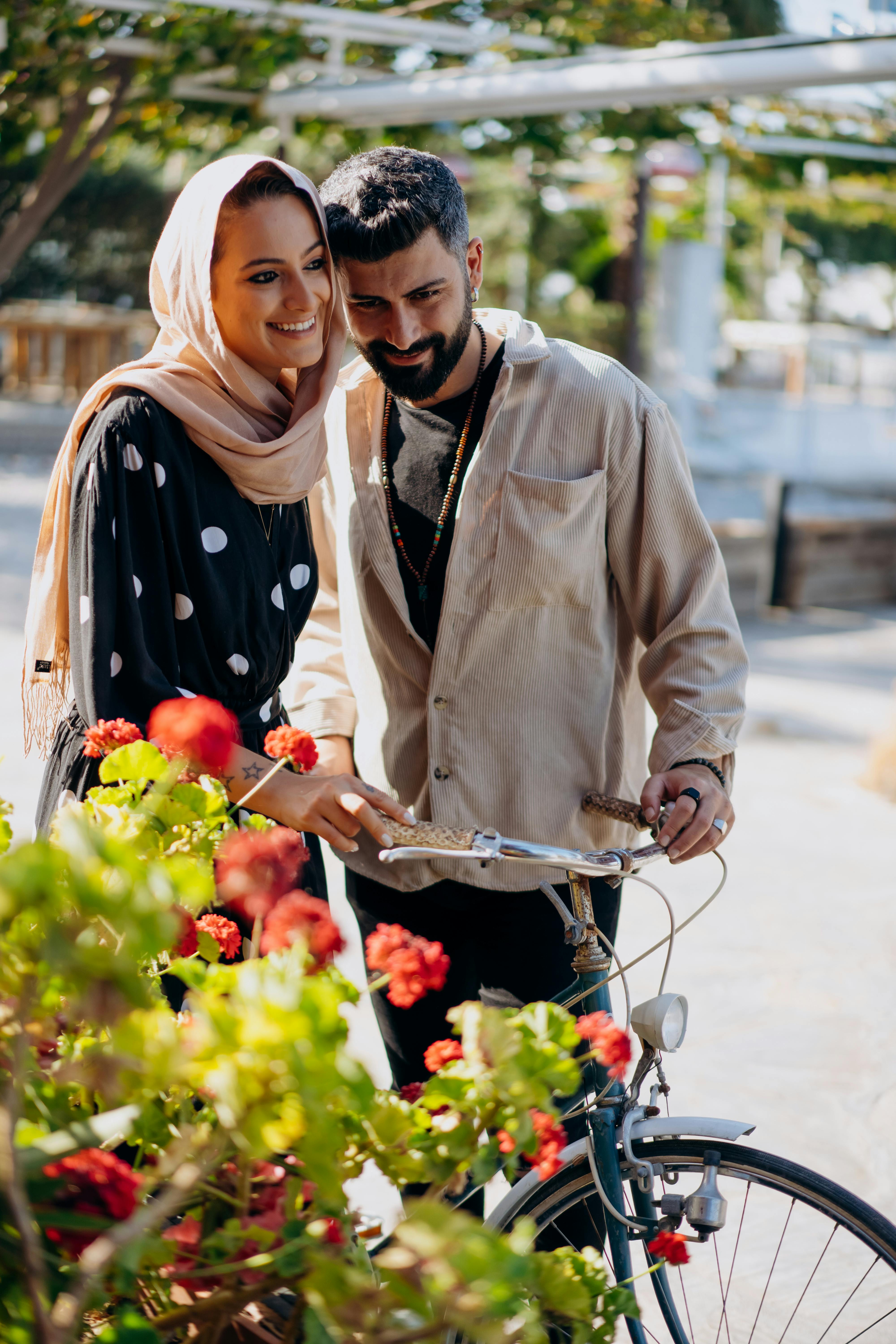 a couple holding a bicycle
