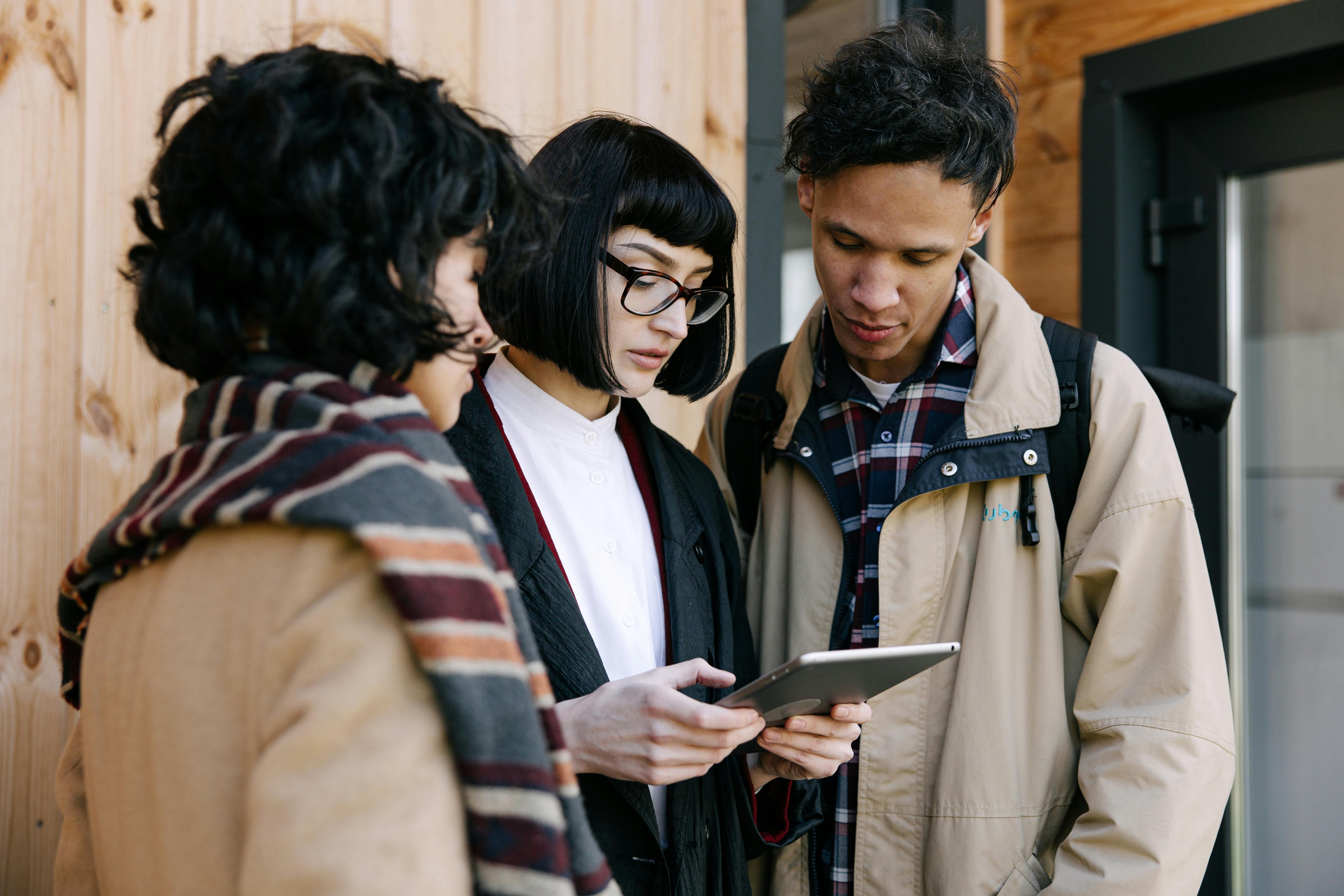 people looking at the tablet computer