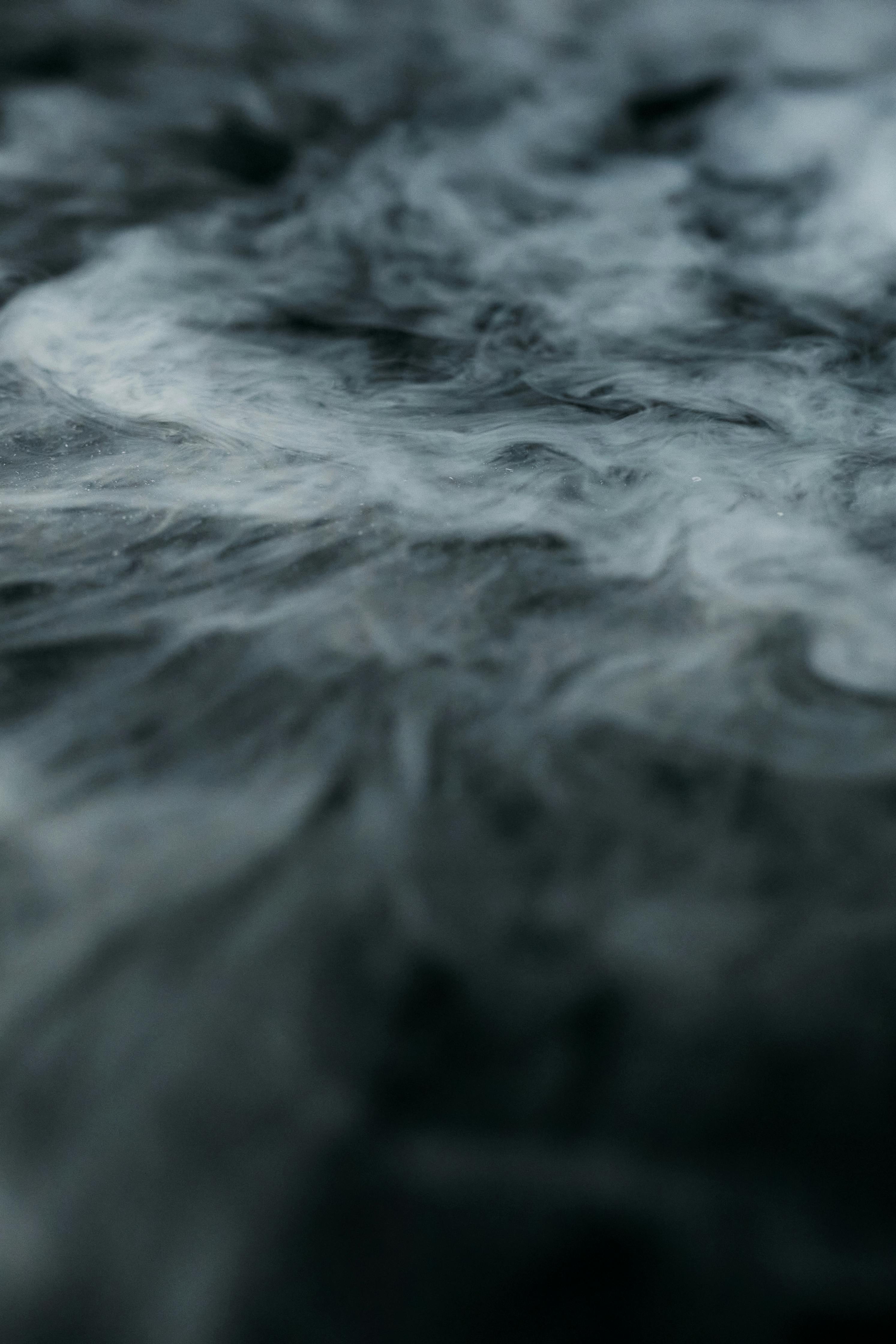 white smoke on black surface