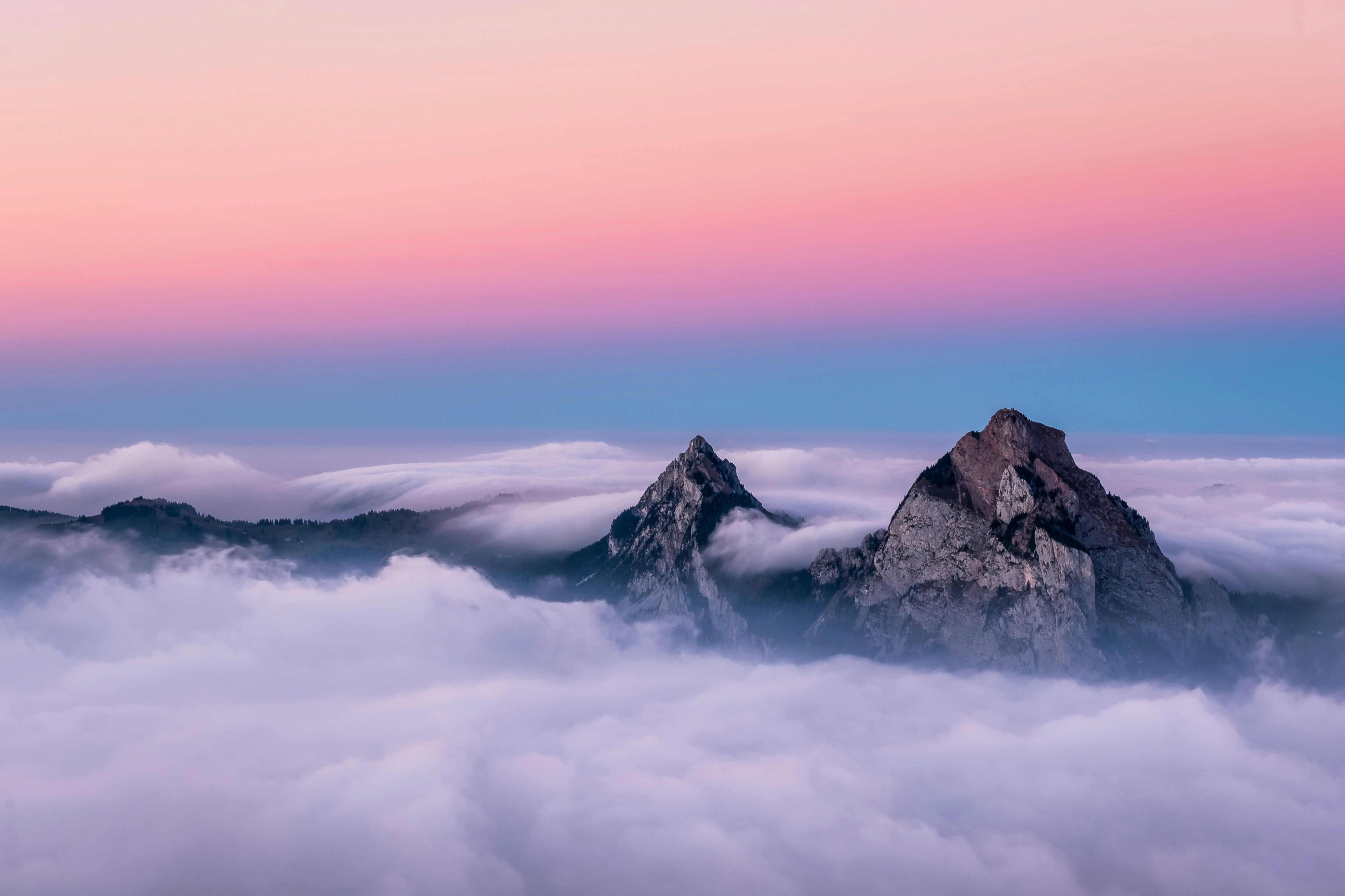 Life is full of adventures. This image was created during one of my own adventures on the top of Fronalpstock in Switzerland. During the day thousands and thousands of tourists where passing by this spot. But the last chairlift was running at 5:30pm. Suddently the place became very quiet and calm. The fog started to clear up and reveal the two peaks. This image represents one of the most beautiful sunsets I ever saw.