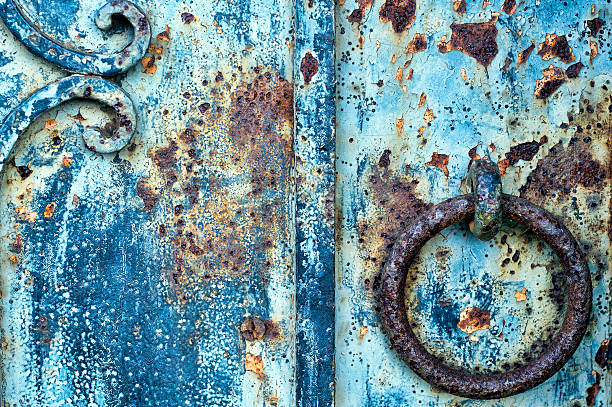 Detail of Old, Rusty Door Knocker Detail of Old, Rusty Door Knocker on a Blue Door must be darrell stock pictures, royalty-free photos & images